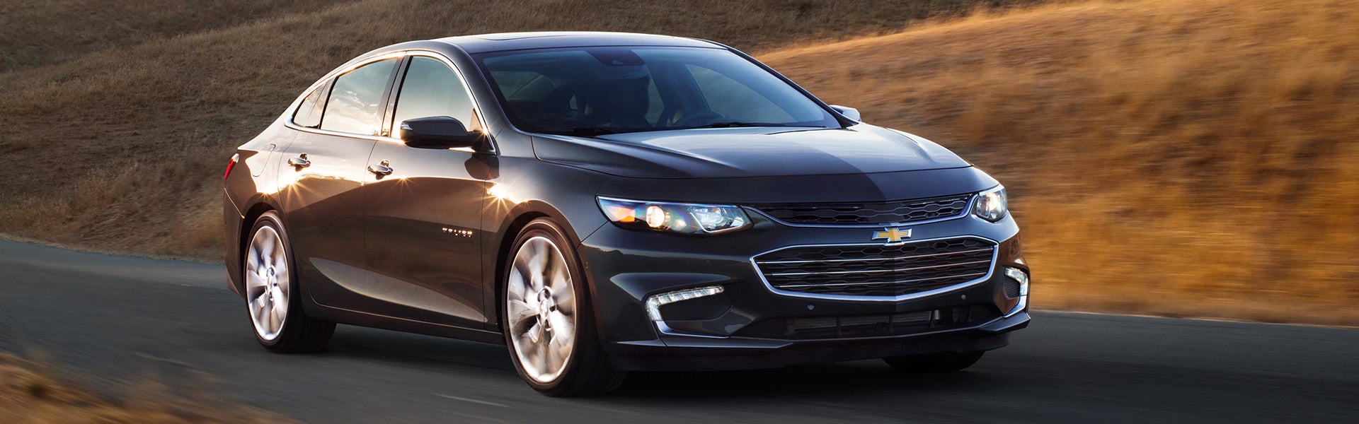 Chevrolet Malibu running on road